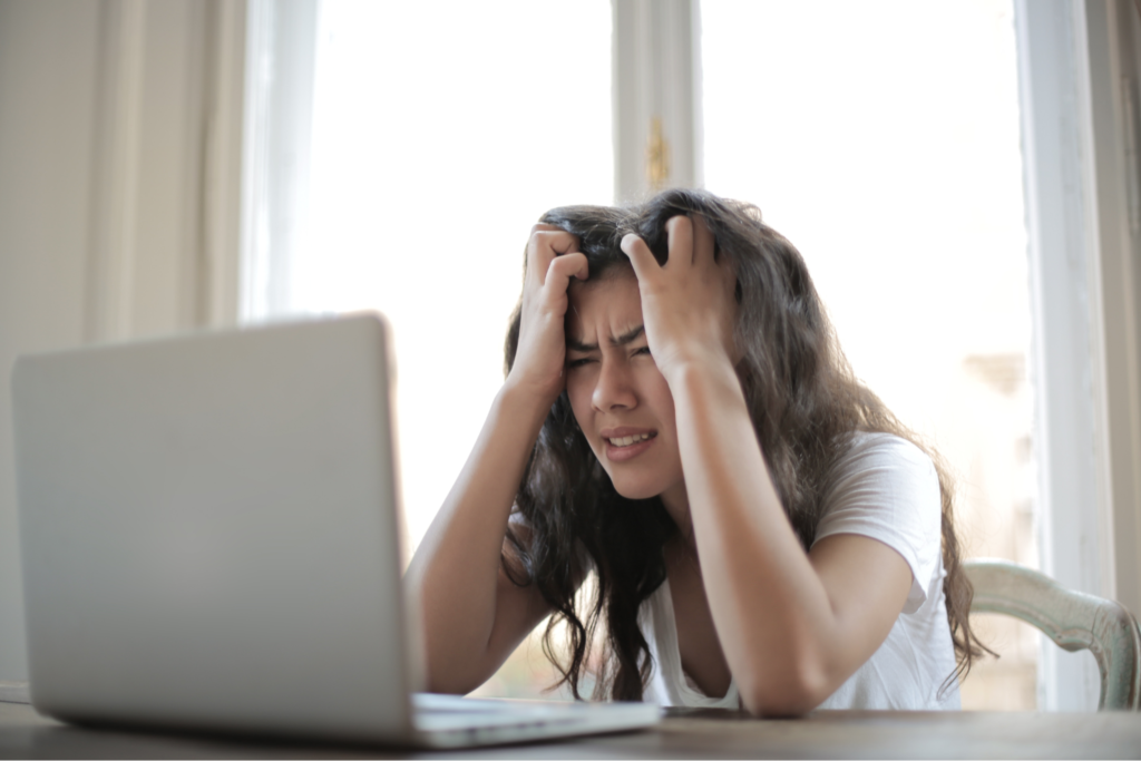 Woman In Stress Finding Out The Way In Her Laptop To Cope Up With Her Stress
