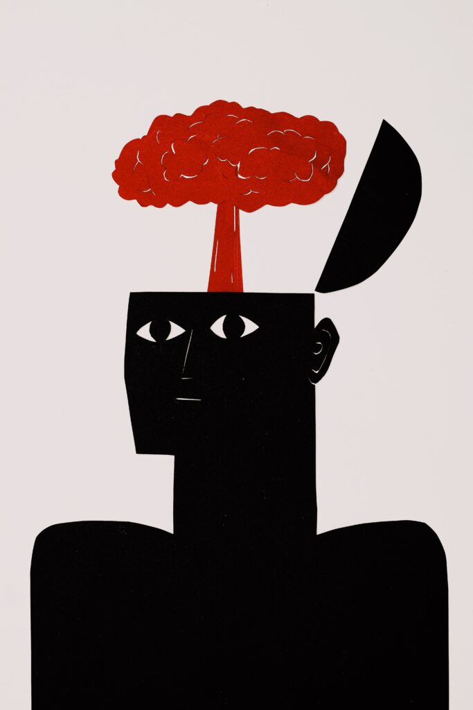 An illustration of a head with the top opened up and a cloud of smoke coming out of it. The head is black, and the cloud is red. You can only see half of the head, the nose up. This illustrates how important the parts of our brain that can cause us to feel emotionally numb.